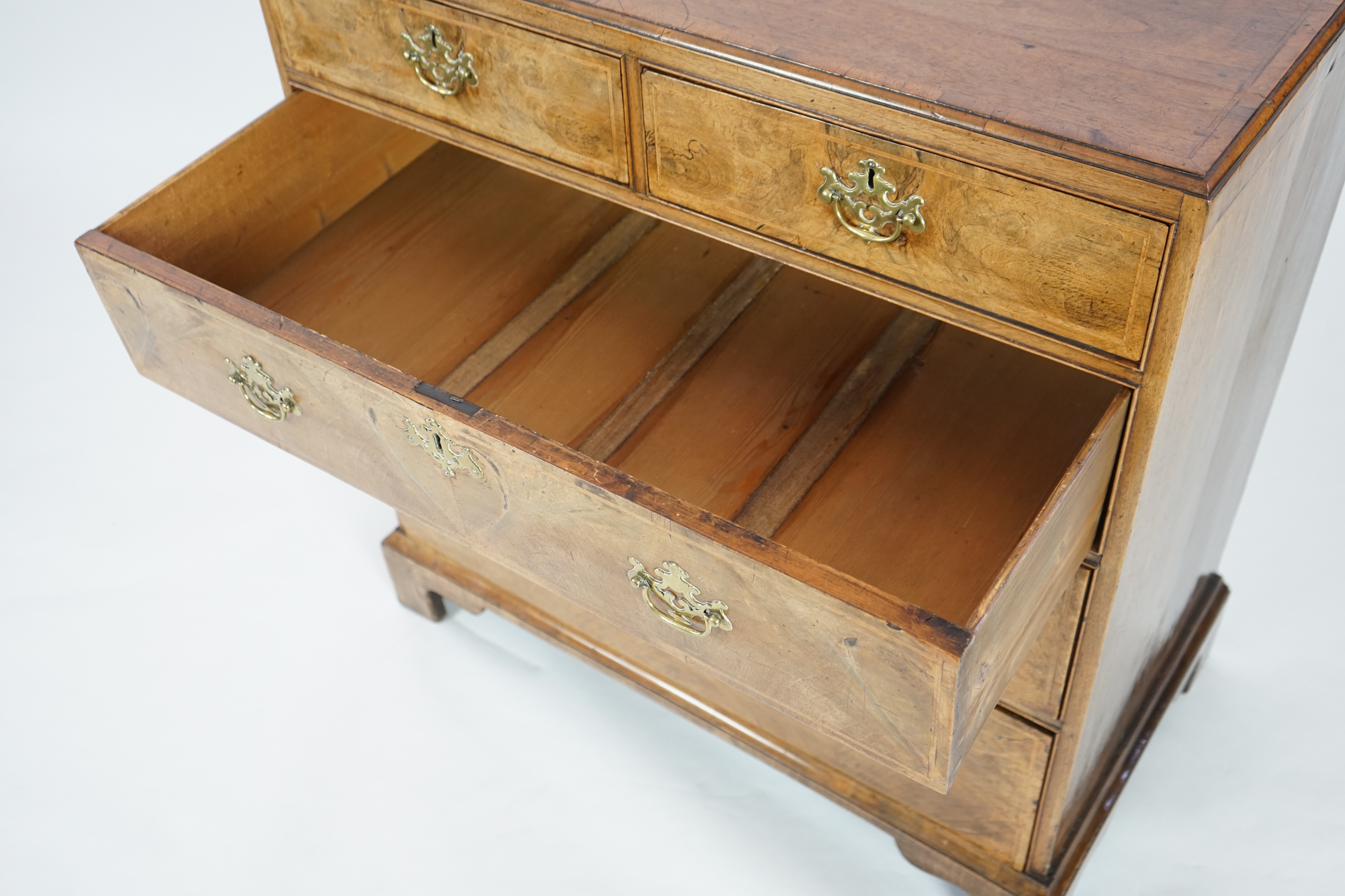 A George II walnut and feather banded caddy top chest